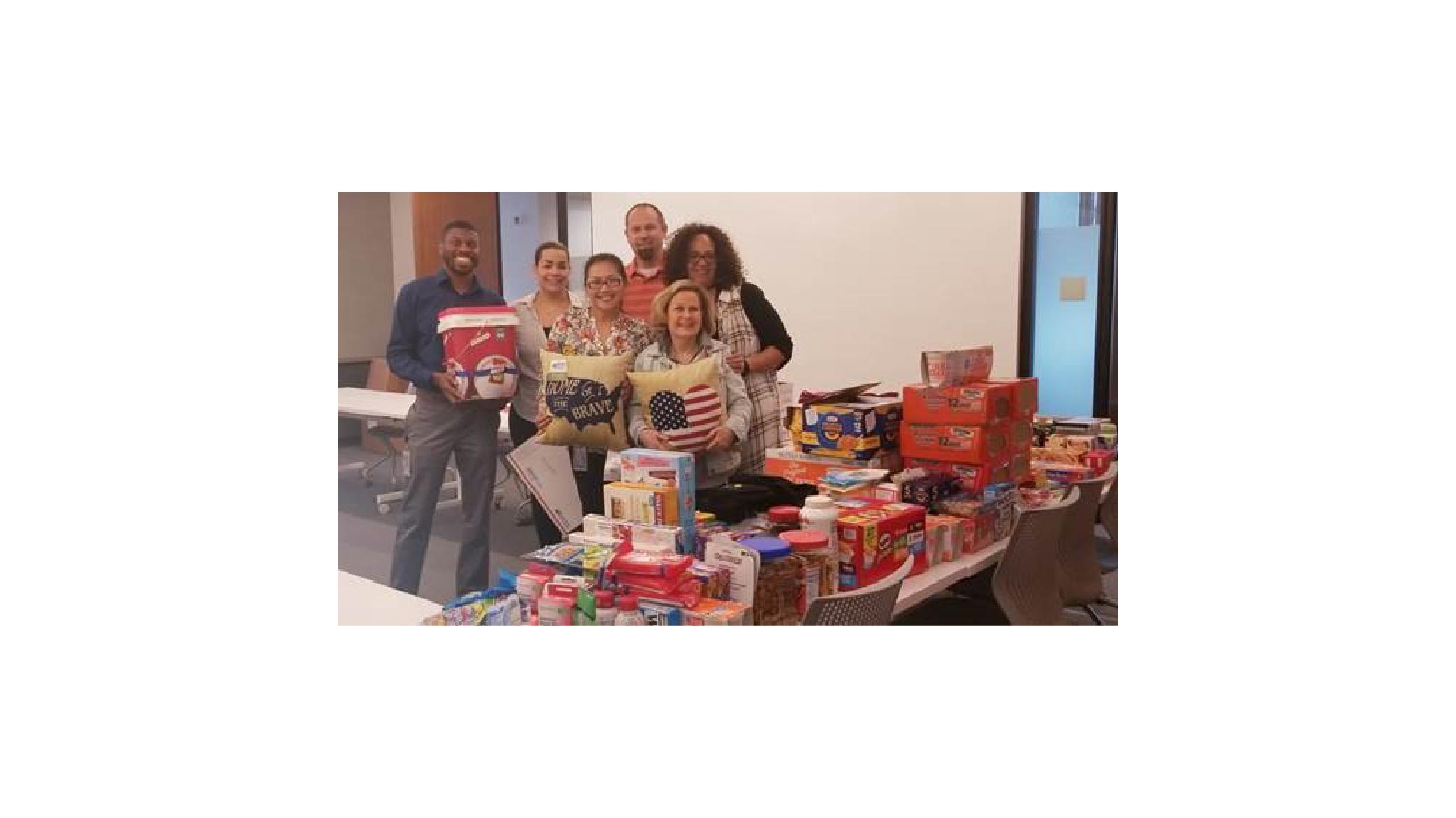 Firestone Building Products collect items for millitary members